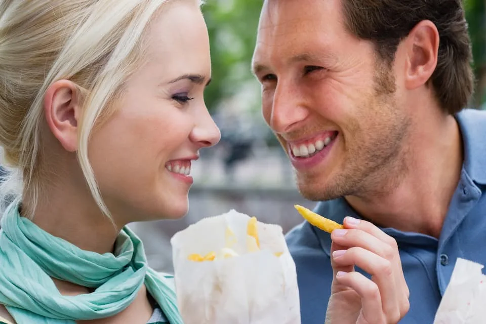 couple with on of the popular street foods, french fries - Chef's Deal
